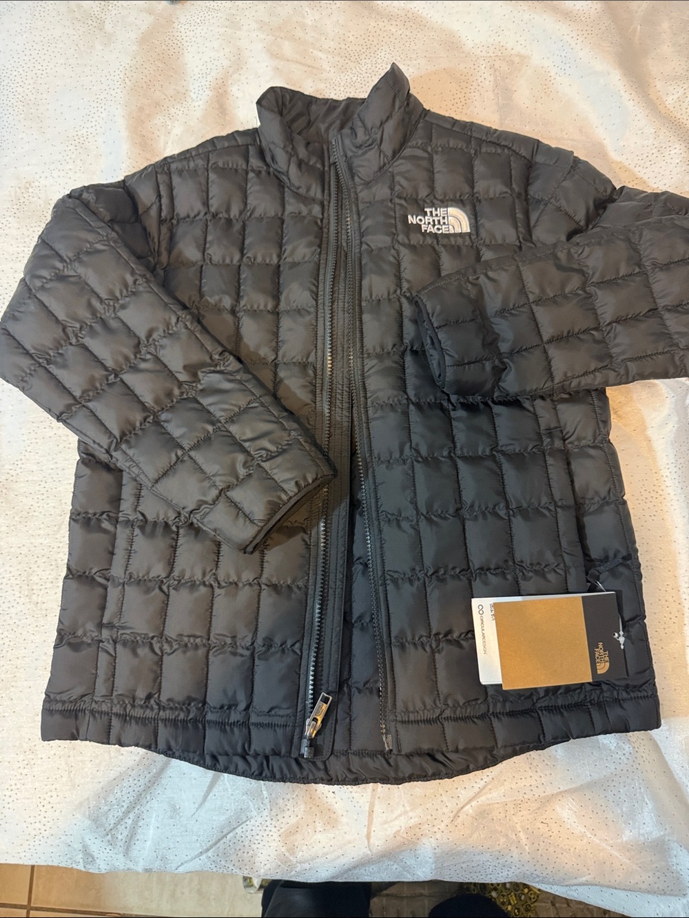 The North Face Kids' Black Insulated Puffer Jacket for kids size L12
